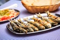 Grilled sardines with salad, bread and potato