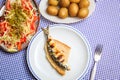 Grilled sardines with salad, bread and potato