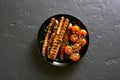 Grilled sausage and cherry tomatoes Royalty Free Stock Photo