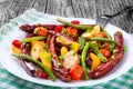 Grilled sausage with garlic, potato, cherry tomatoes, green beans, top-view Royalty Free Stock Photo