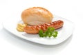 Grilled Sausage with mustard, bread and parsley Royalty Free Stock Photo