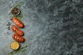 Grilled sausage, mustard and spices on black smokey background Royalty Free Stock Photo