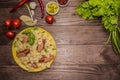 Grilled sausage with pasta, slices of bread, herbs and cherry tomatoes. On a wooden rustic brown background. Top view Royalty Free Stock Photo