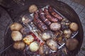 Grilled sausage and potaoes, barbecue Royalty Free Stock Photo