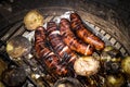 Grilled sausage and potaoes, barbecue Royalty Free Stock Photo