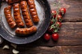 Grilled sausage and vegetables on table Royalty Free Stock Photo