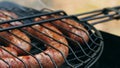 Grilled sausages on bbq. Variety `Original Nuremberg Rostbratwurst`.