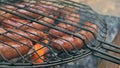 Grilled sausages on bbq. Variety `Original Nuremberg Rostbratwurst`.