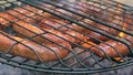 Grilled sausages on bbq. Variety `Original Nuremberg Rostbratwurst`.