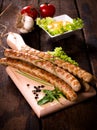 Grilled sausages on board