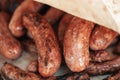 Grilled sausages or bratwurst on grill with smoke and flame Royalty Free Stock Photo