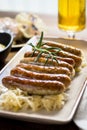 Grilled Sausages with Cabbage Salad, Mustard and Beer. Bratwurst and Sauerkraut.