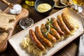 Grilled Sausages with Cabbage Salad, Mustard and Beer Royalty Free Stock Photo