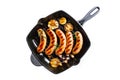 Grilled sausages on cast iron grill pan