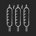 Grilled sausages chalk white icon on black background Royalty Free Stock Photo