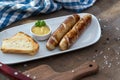 Grilled sausages. Closeup of sausage on the grill. Home-made Sausages. Bavarian sausages Royalty Free Stock Photo