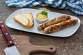 Grilled sausages. Closeup of sausage on the grill. Home-made Sausages. Bavarian sausages Royalty Free Stock Photo