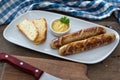 Grilled sausages. Closeup of sausage on the grill. Home-made Sausages. Bavarian sausages Royalty Free Stock Photo