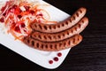 Grilled sausages with easy side dish of sauerkraut and cranberry