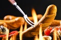 Grilled sausages on the flaming grill Royalty Free Stock Photo