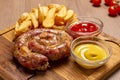 Grilled sausages with french fries with ketchup and mustard Royalty Free Stock Photo