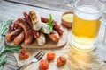 Grilled sausages with glass of beer Royalty Free Stock Photo