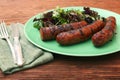 Grilled sausages with greens