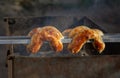 Grilled sausages on grill with smoke Royalty Free Stock Photo