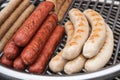 Grilled sausages on a metal grill Royalty Free Stock Photo