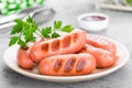 Grilled sausages on plate. BBQ sausages. Royalty Free Stock Photo