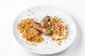 Grilled sausages, potatoes and braised cabbage on white plate close-up view from above. Royalty Free Stock Photo