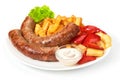 Grilled sausages with potatoes fries solated on white background Royalty Free Stock Photo