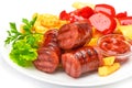 Grilled sausages with potatoes fries and sweet bulgarian peppers and red sauce ketchup Royalty Free Stock Photo