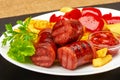Grilled sausages with potatoes fries and sweet bulgarian peppers and red sauce ketchup Royalty Free Stock Photo