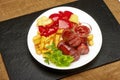 Grilled sausages with potatoes fries and sweet bulgarian peppers and red sauce ketchup Royalty Free Stock Photo