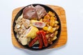 Grilled sausages with potatoes, mushrooms and roasted chicken on a grill pan Royalty Free Stock Photo