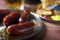 Grilled sausages prepared on grill Royalty Free Stock Photo