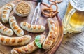 Grilled sausages with pretzels and mug of beer Royalty Free Stock Photo