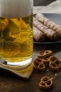 Grilled sausages with pretzels and mugs of beer Royalty Free Stock Photo