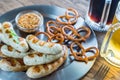 Grilled sausages with pretzels and mugs of beer Royalty Free Stock Photo