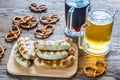 Grilled sausages with pretzels and mugs of beer Royalty Free Stock Photo