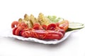 Grilled sausages and roasted potatoes with salad on white plate Royalty Free Stock Photo