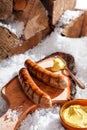 Grilled sausages served outdoors in the snow Royalty Free Stock Photo