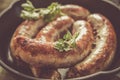 Grilled sausages served on wood board Royalty Free Stock Photo