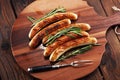 Grilled sausages with spices on a wooden table - Home-made Pork Sausages Royalty Free Stock Photo