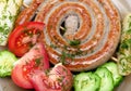 Grilled sausages with vegetables and dill close-up Royalty Free Stock Photo