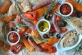 Grilled sausages and vegetables platter served with humus and pita bread, Royalty Free Stock Photo