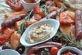 Grilled sausages and vegetables platter served with humus and pita bread, Royalty Free Stock Photo