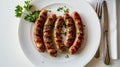 Grilled sausages on a white plate Royalty Free Stock Photo