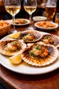 Grilled Scallops Served In Shells With White Wine In Cozy Restaurant Setting Royalty Free Stock Photo